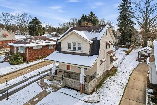 a aerial view of a house with a yard