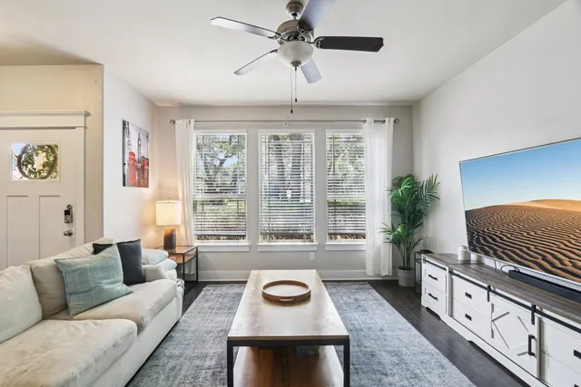 a living room with furniture and a window