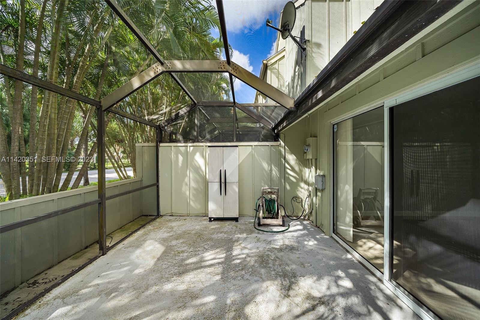 6351 Riverwalk Lane, Unit 4 Jupiter, FL 33458 - Photo 20 of 40 a view of a house with a yard