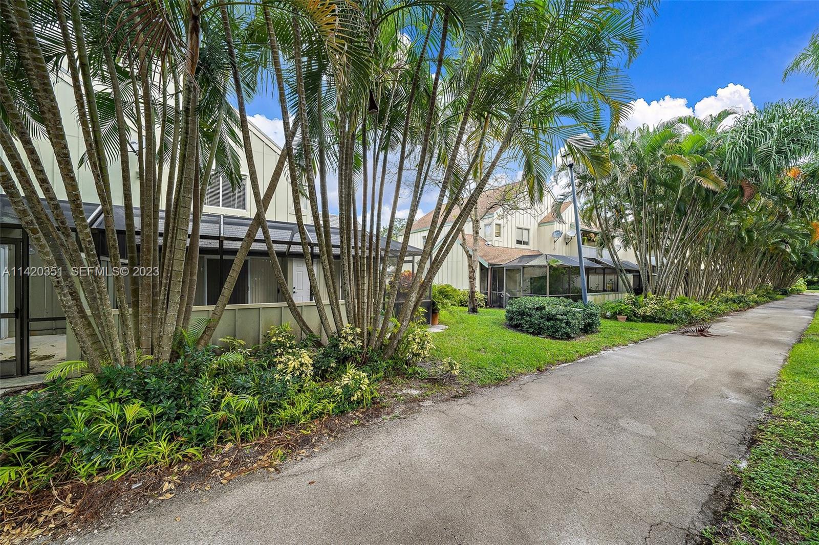 6351 Riverwalk Lane, Unit 4 Jupiter, FL 33458 - Photo 22 of 40 a view of a backyard