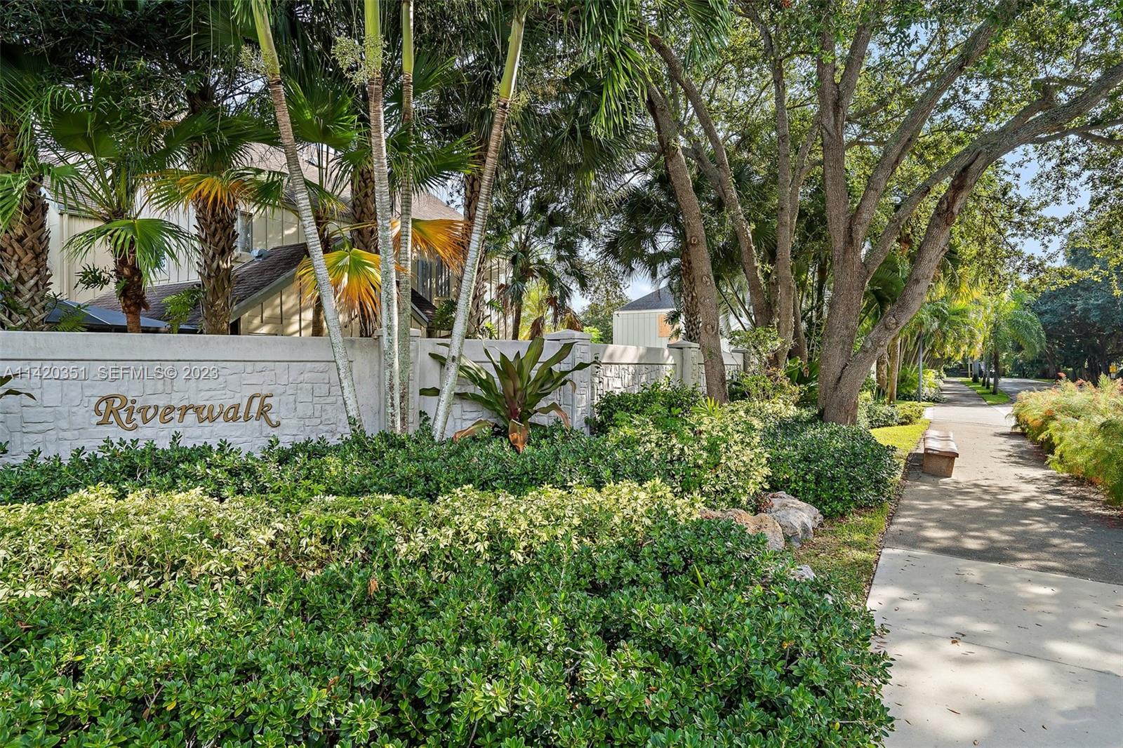 6351 Riverwalk Lane, Unit 4 Jupiter, FL 33458 - Photo 30 of 40 a view of a pathway with a tree