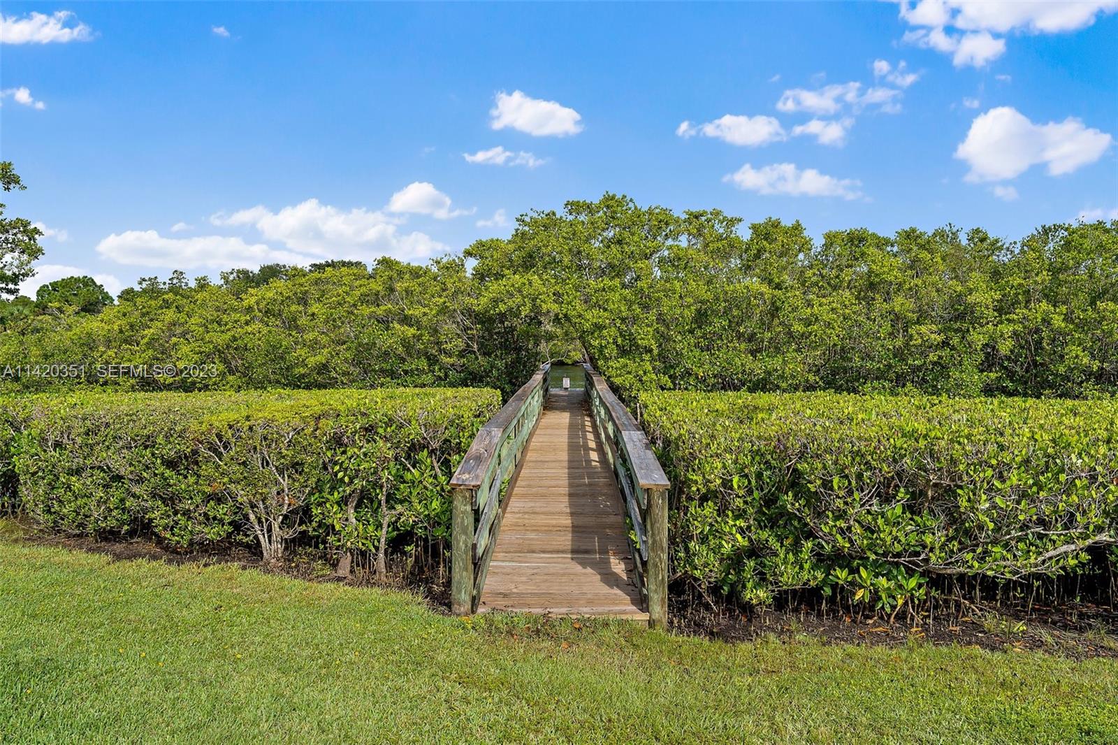 6351 Riverwalk Lane, Unit 4 Jupiter, FL 33458 - Photo 34 of 40 a view of a garden with a house