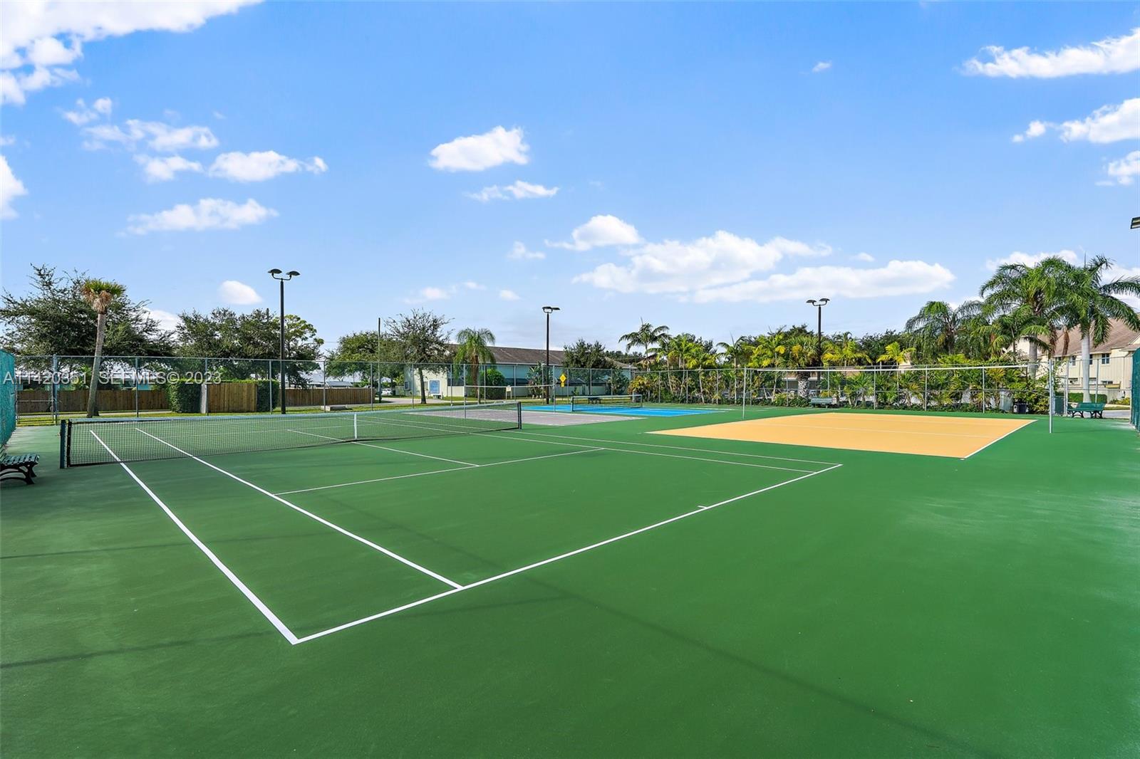 6351 Riverwalk Lane, Unit 4 Jupiter, FL 33458 - Photo 38 of 40 a view of a tennis court