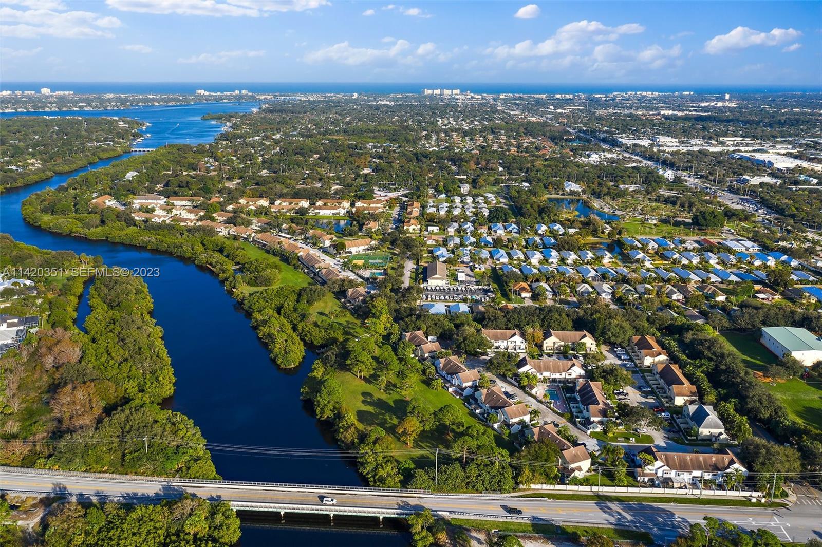6351 Riverwalk Lane, Unit 4 Jupiter, FL 33458 - Photo 40 of 40 an aerial view of residential houses with outdoor space and river