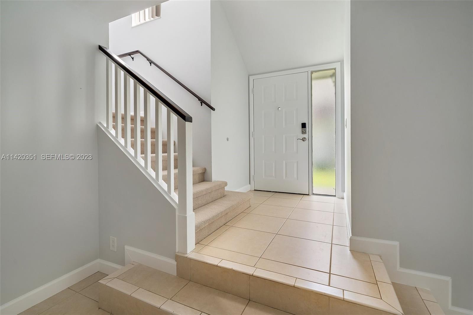 6351 Riverwalk Lane, Unit 4 Jupiter, FL 33458 - Photo 5 of 40 a view of a hallway with staircase