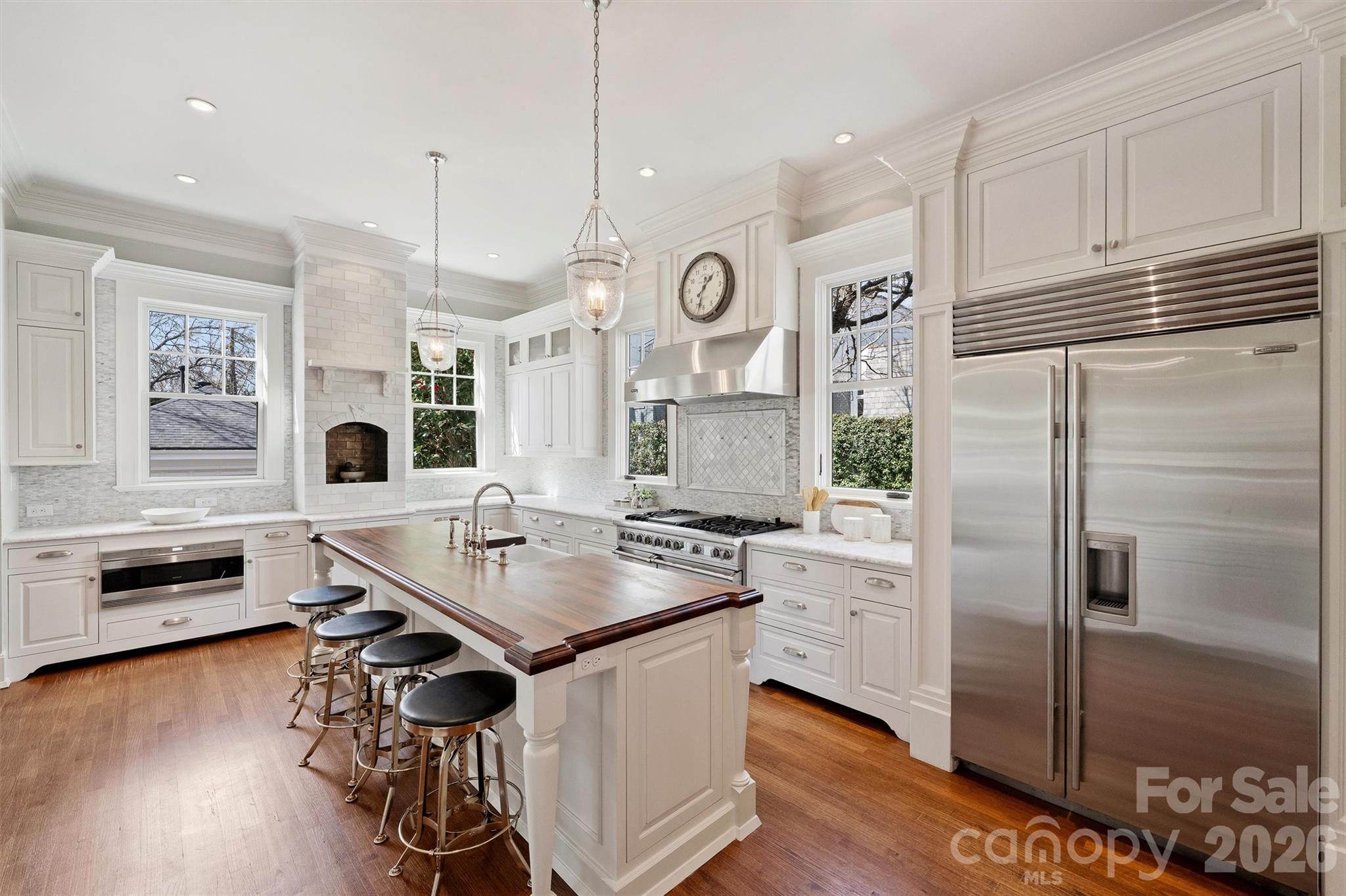 1136 Queens Road Charlotte, NC 28207 - Photo 12 of 43 a kitchen with stainless steel appliances granite countertop a stove a refrigerator and a refrigerator