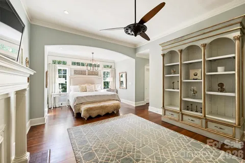 a spacious bedroom with a bed and a walk in closet