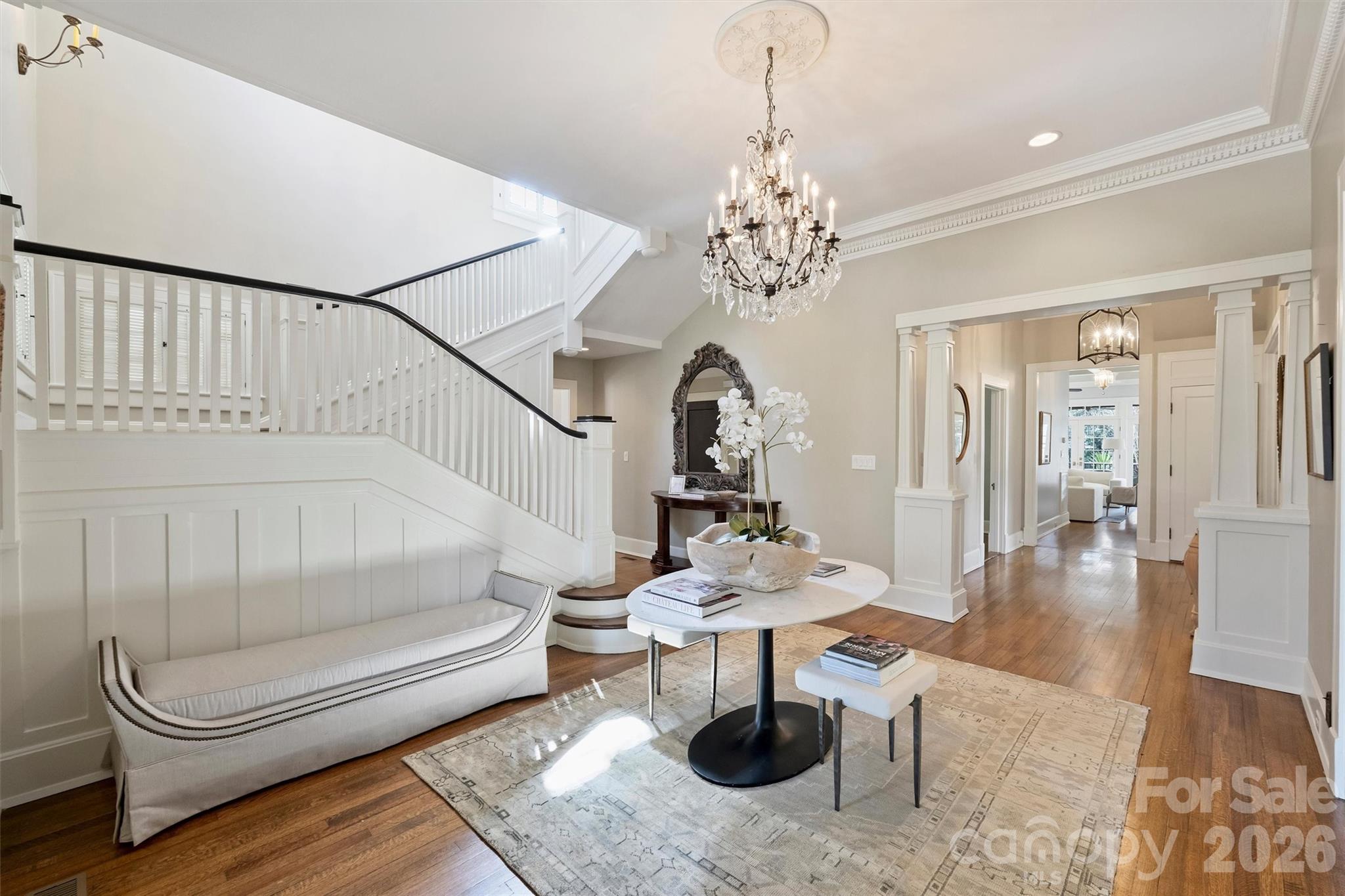 1136 Queens Road Charlotte, NC 28207 - Photo 3 of 43 a living room with furniture and a chandelier