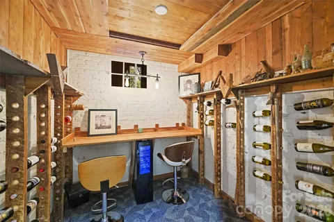 a view of a kitchen with a table and chairs