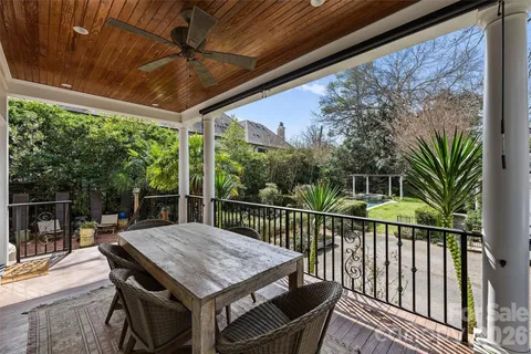 a view of a patio with a table chairs and a table
