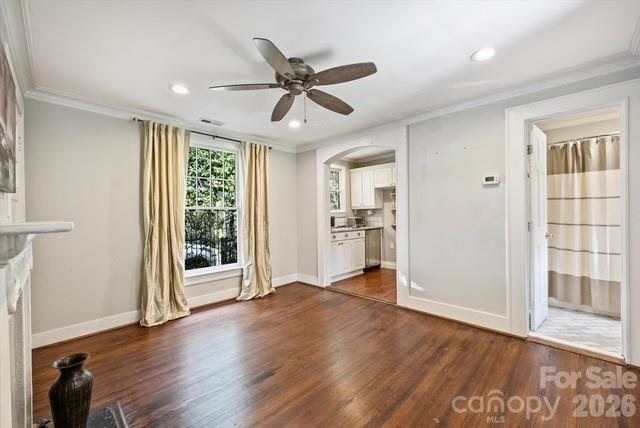 1136 Queens Road Charlotte, NC 28207 - Photo 42 of 43 a view of an empty room with a window and wooden floor