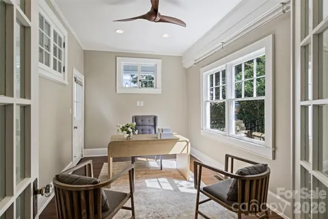 a dining room with furniture and window