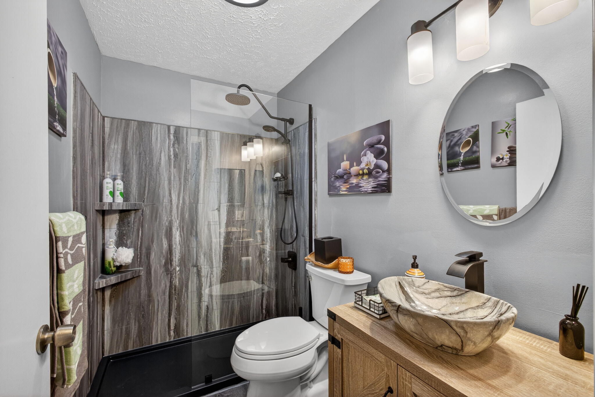 12558 165th Road North Jupiter, FL 33478 - Photo 33 of 67 a bathroom with a granite countertop toilet a sink and a mirror