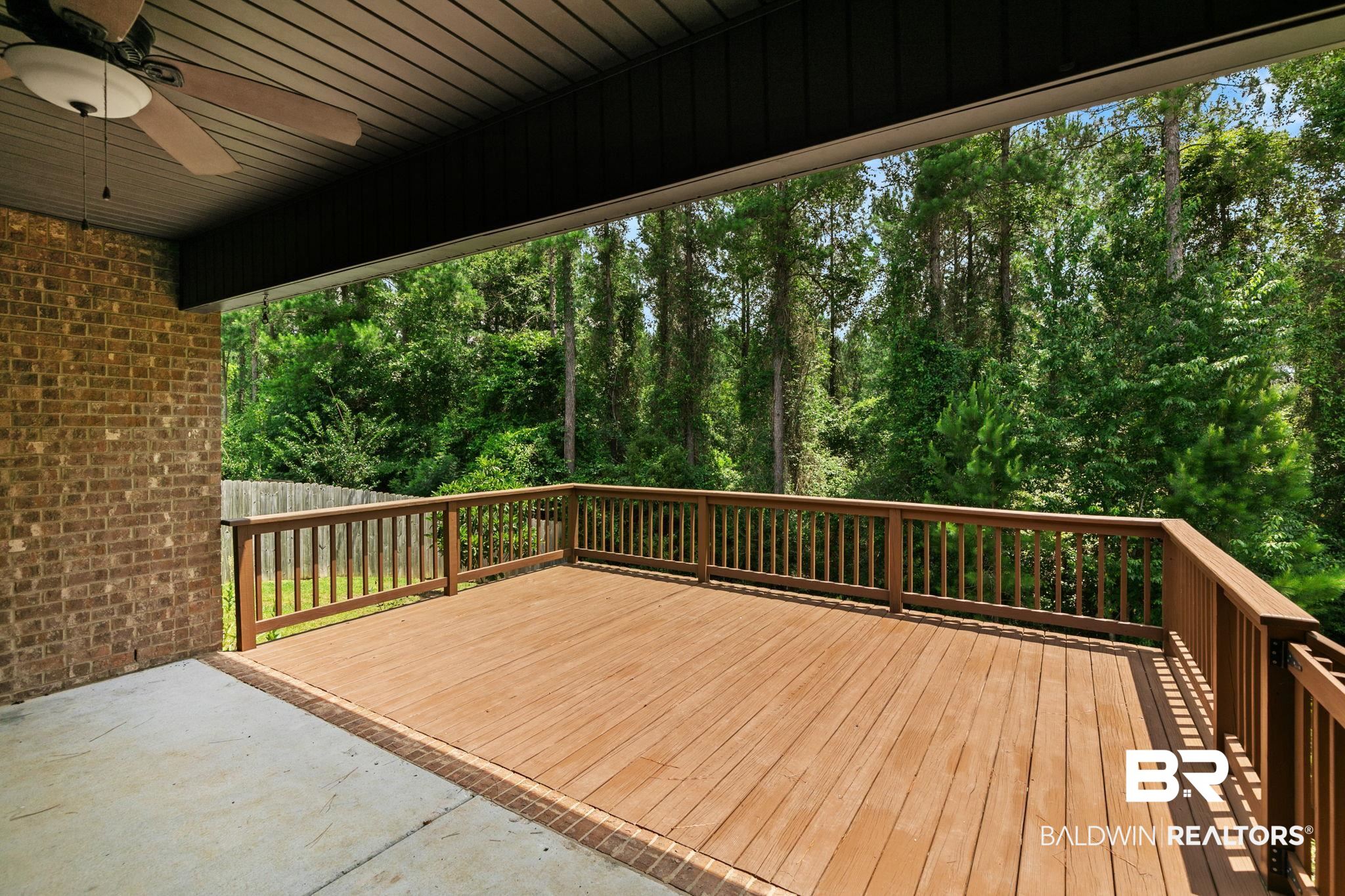 31350 Hoot Owl Road Daphne, AL 36527 - Photo 48 of 94 Expansive outdoor deck featuring wood-finish flooring, full-height railings, and an integrated ceiling fan