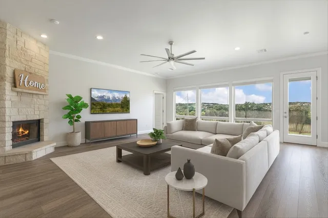 a living room with furniture and a fireplace
