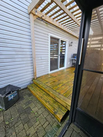 a view of a deck with a yard