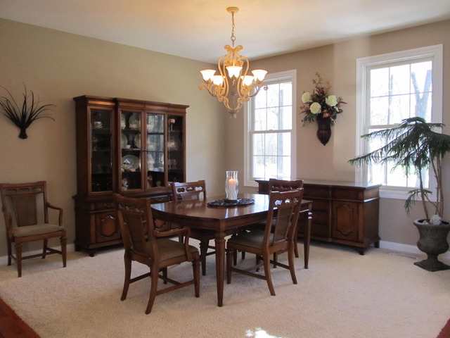 9398 Oak Ridge Drive Rochelle, IL 61068 - Photo 11 of 25 a view of a dining room with furniture and chandelier