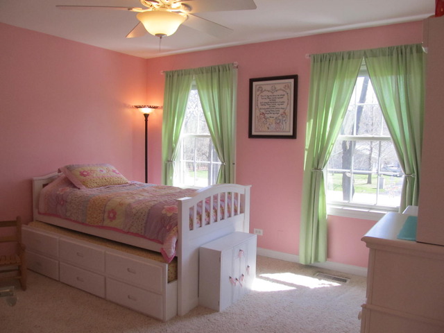 9398 Oak Ridge Drive Rochelle, IL 61068 - Photo 19 of 25 a living room with a bed and a window