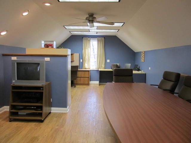 9398 Oak Ridge Drive Rochelle, IL 61068 - Photo 23 of 25 a living room with furniture and a flat screen tv