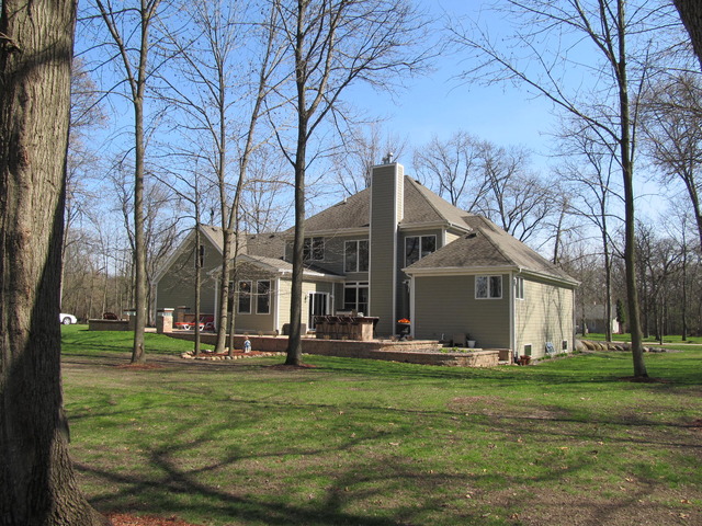 9398 Oak Ridge Drive Rochelle, IL 61068 - Photo 5 of 25 a front view of house with yard and green space