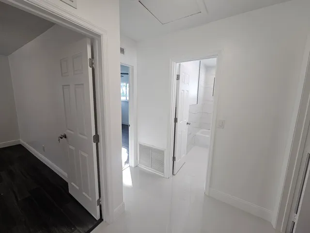 a view of a bathroom from a hallway