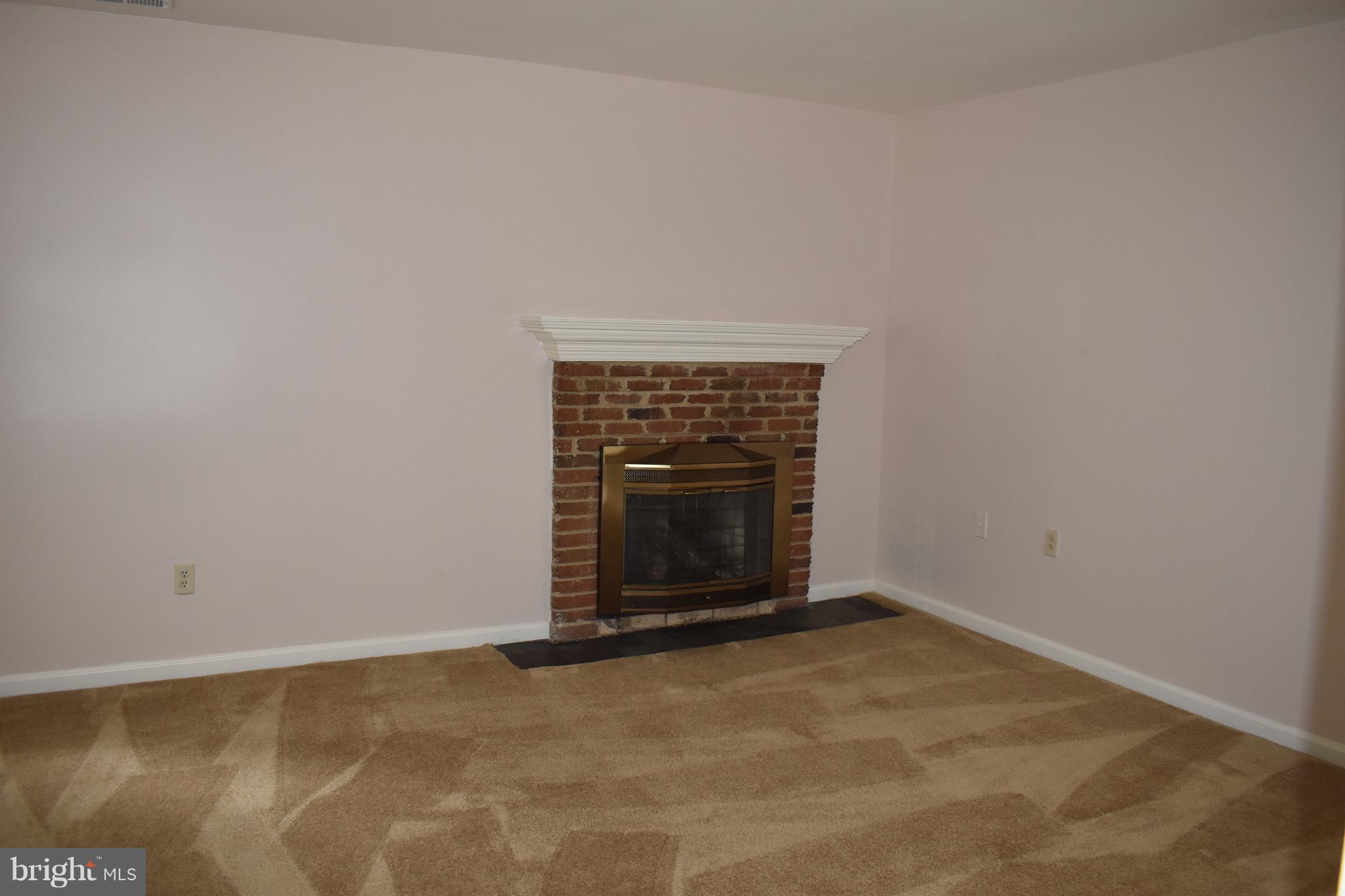 12906 Fletchertown Road Bowie, MD 20720 - Photo 18 of 30 MASTER BED ROOM WITH GAS FIREPLACE