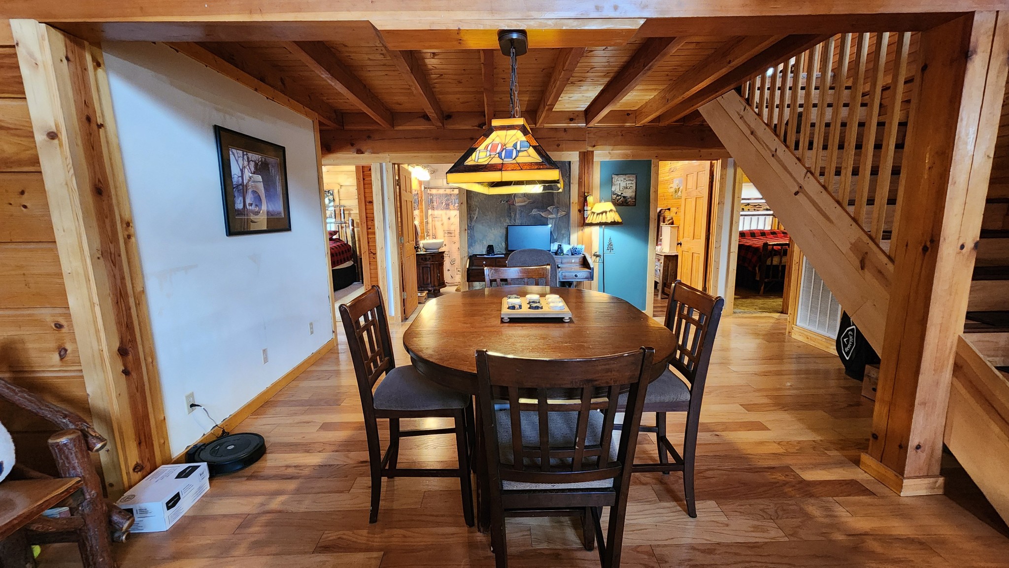 5615 Eastport Road Alpine, TN 38543 - Photo 23 of 83 a dining room with furniture wooden floor a chandelier