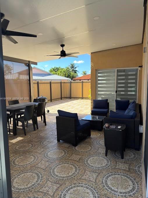 733 Southwest 99th Ct Circle Miami, FL 33174 - Photo 7 of 16 a living room with furniture and a large window