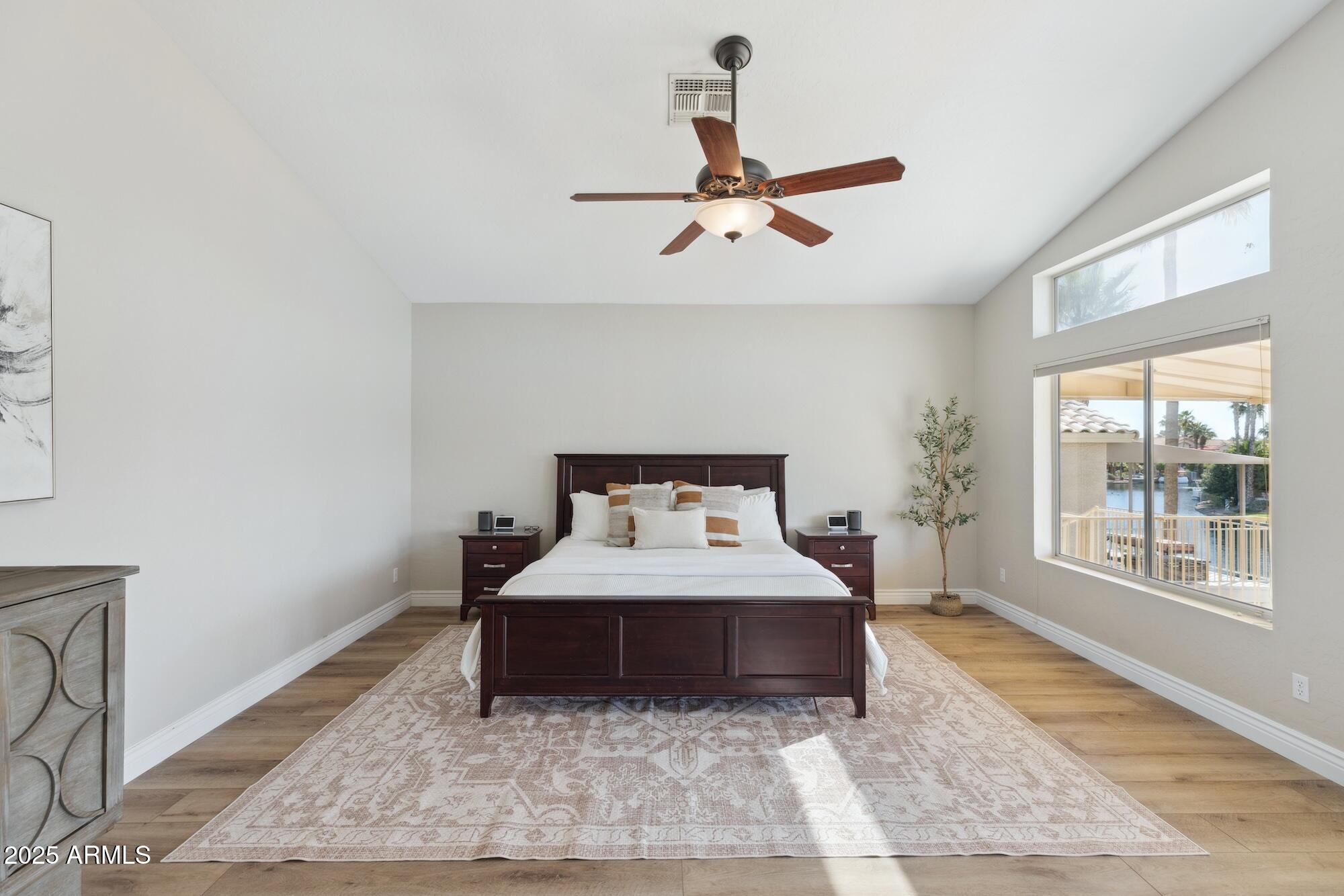 1321 West Shellfish Drive Gilbert, AZ 85233 - Photo 11 of 65 a bedroom with a large bed and a large window