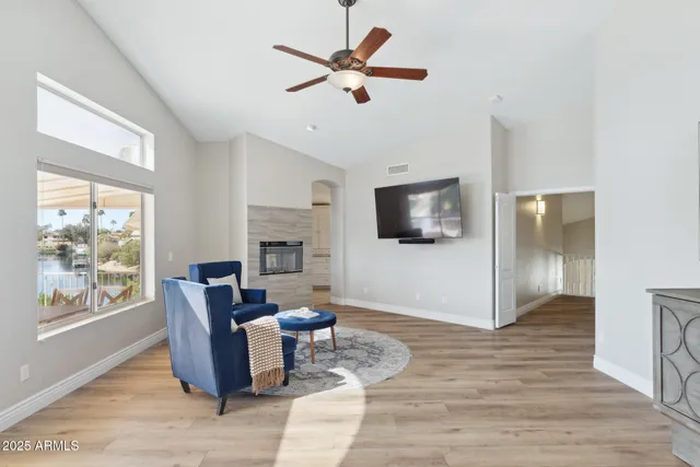 a bathroom with a granite countertop sink mirror and bathtub