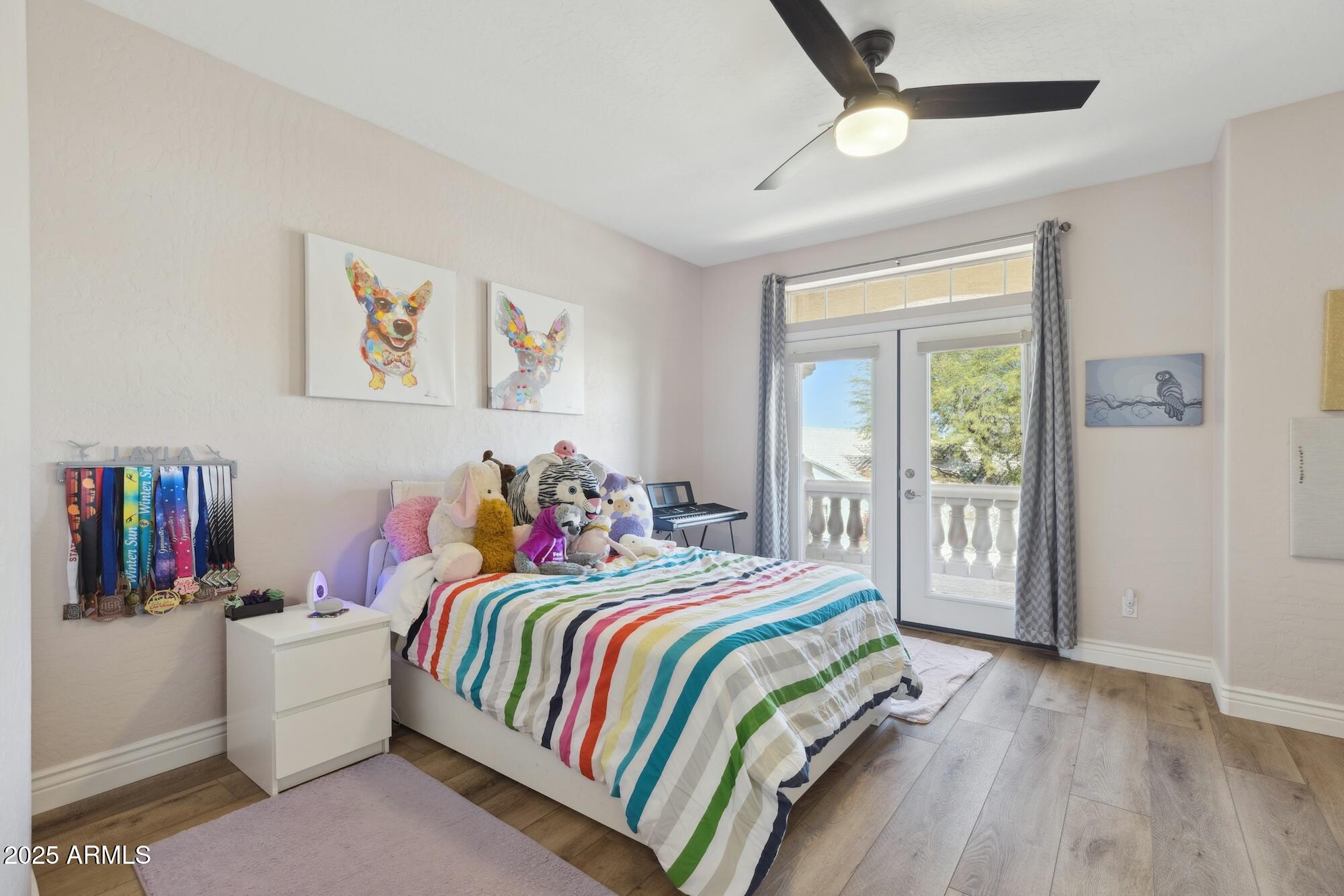 1321 West Shellfish Drive Gilbert, AZ 85233 - Photo 28 of 65 a bedroom with a bed a wall painting and a window