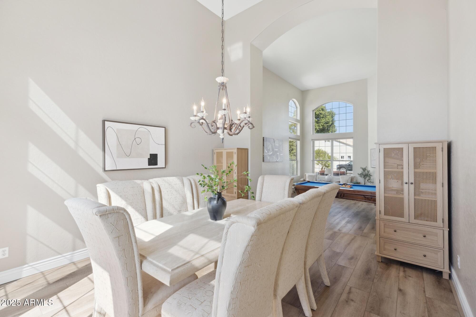 1321 West Shellfish Drive Gilbert, AZ 85233 - Photo 35 of 65 a view of a dining room with furniture window and wooden floor