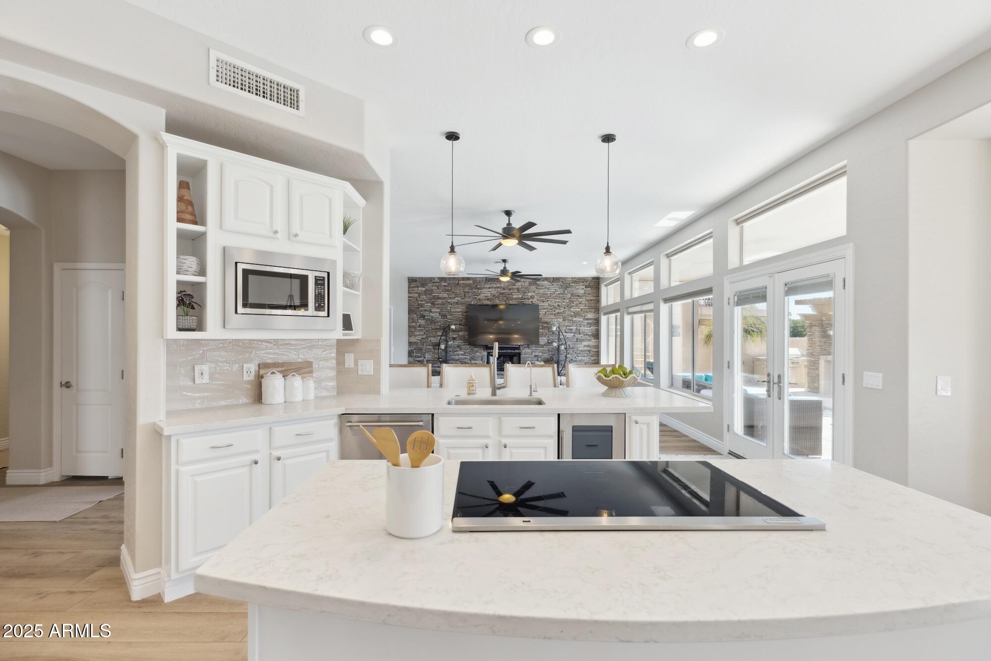 1321 West Shellfish Drive Gilbert, AZ 85233 - Photo 42 of 65 a large white kitchen with a large window appliances and cabinets