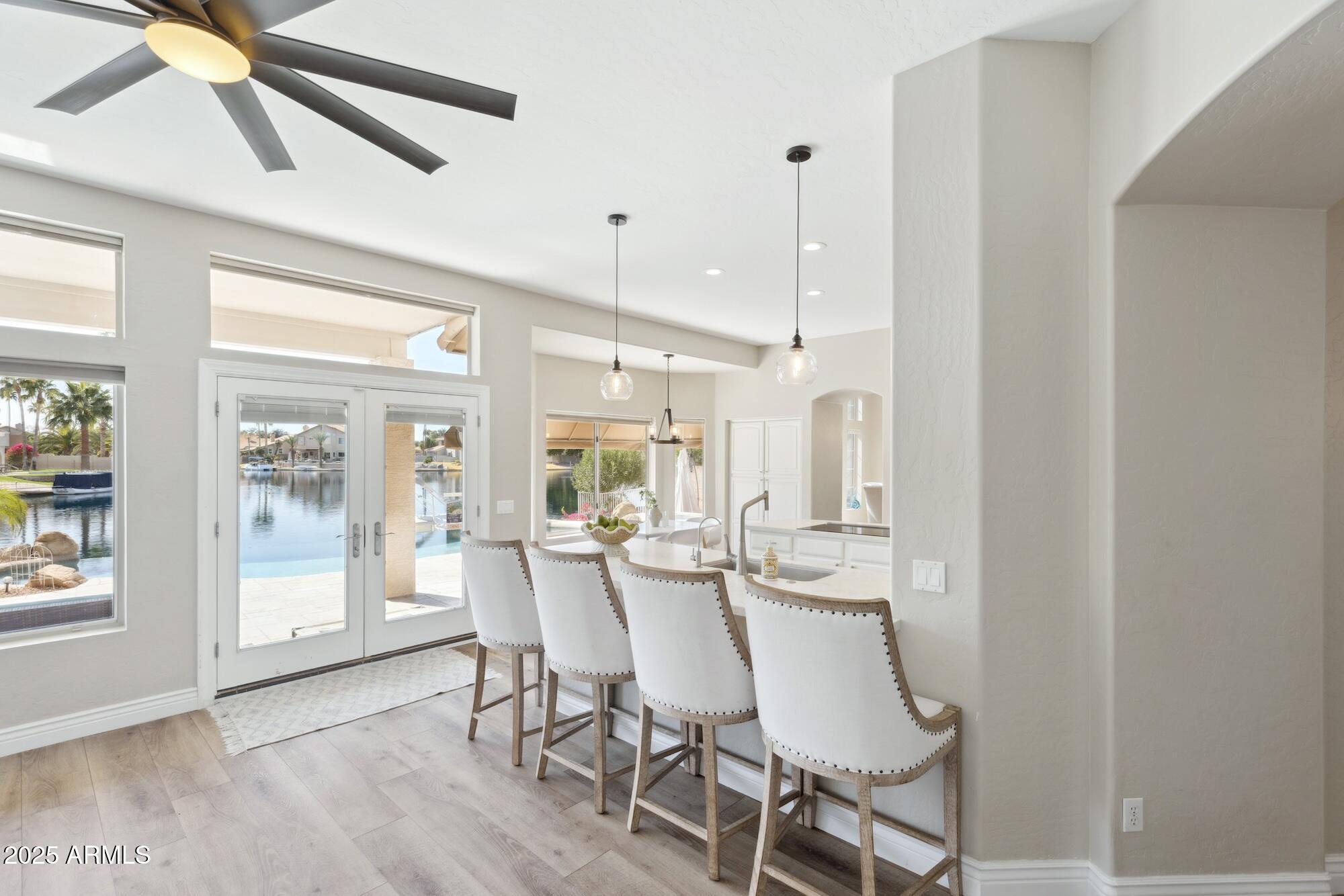 1321 West Shellfish Drive Gilbert, AZ 85233 - Photo 59 of 65 a view of a dining room with furniture window and wooden floor