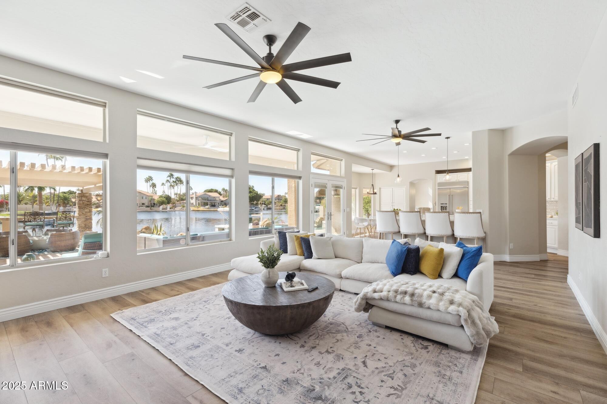 1321 West Shellfish Drive Gilbert, AZ 85233 - Photo 10 of 65 a living room with furniture and a large window