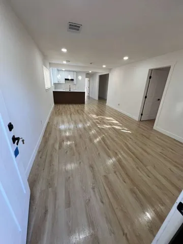 a view of entryway with wooden floor