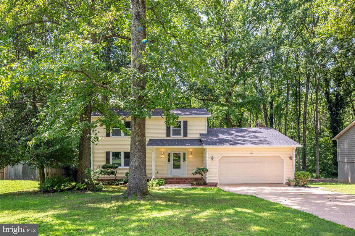 11816 Rutherford Drive Fredericksburg, VA 22407 - Photo 3 of 64 a view of a house with a yard
