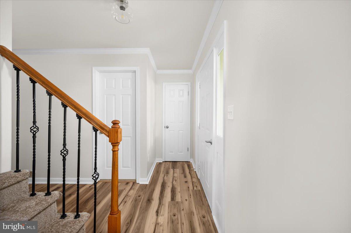 11816 Rutherford Drive Fredericksburg, VA 22407 - Photo 31 of 64 a view of a hallway with wooden floor and staircase