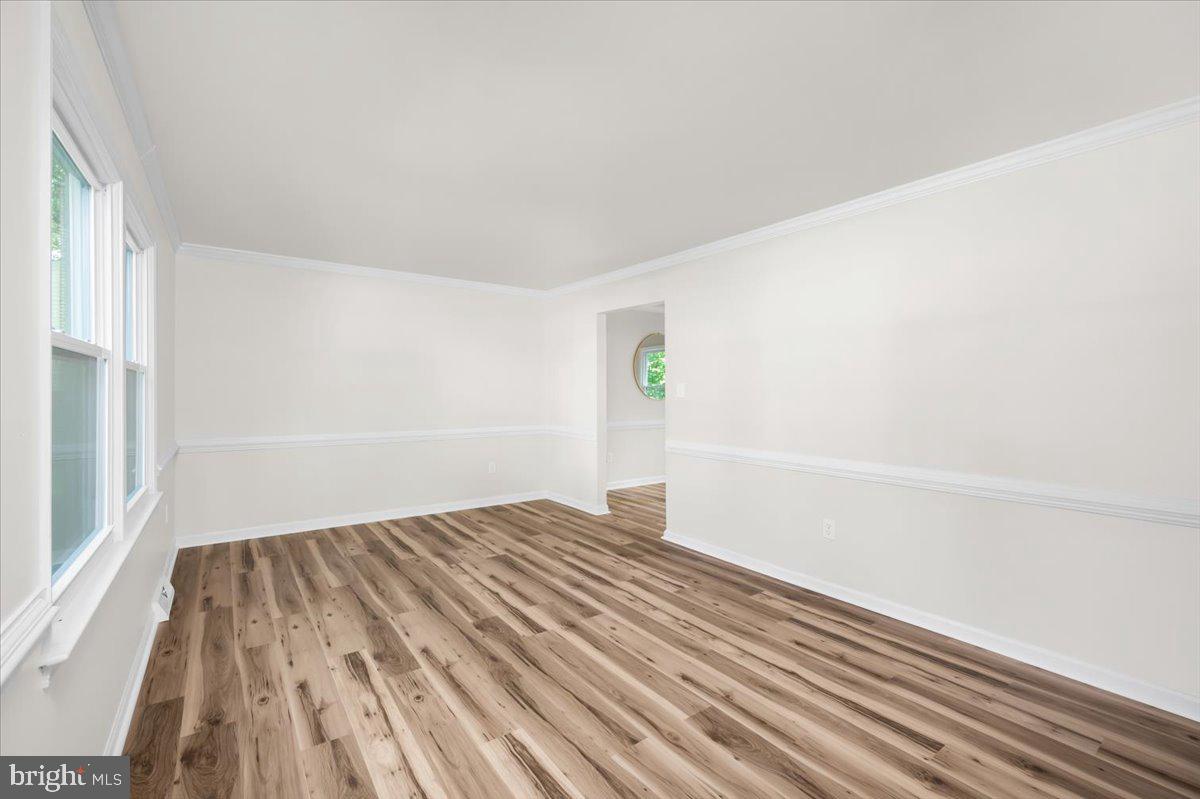 11816 Rutherford Drive Fredericksburg, VA 22407 - Photo 35 of 64 a view of empty room with wooden floor and fan