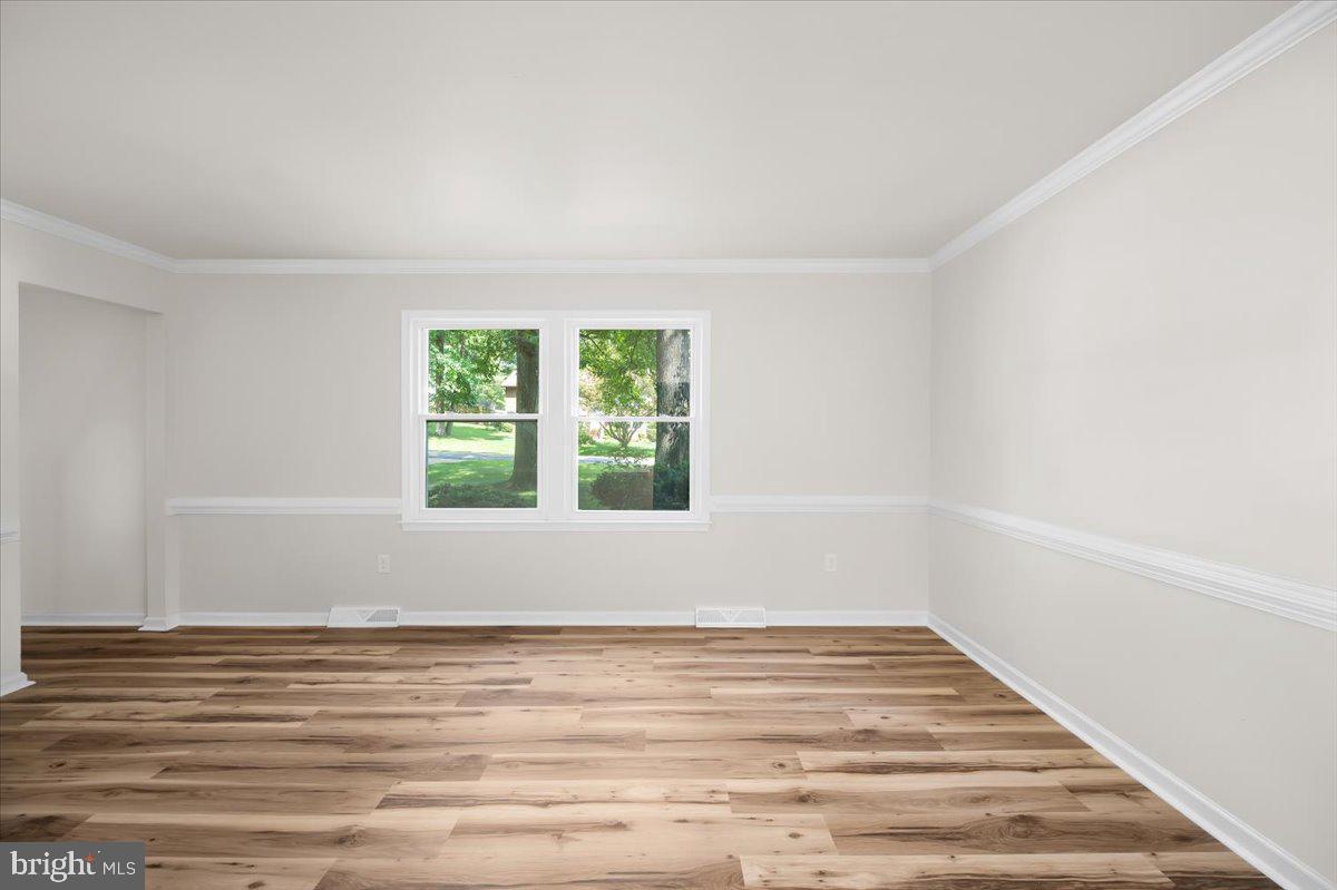 11816 Rutherford Drive Fredericksburg, VA 22407 - Photo 36 of 64 a view of empty room with wooden floor and fan