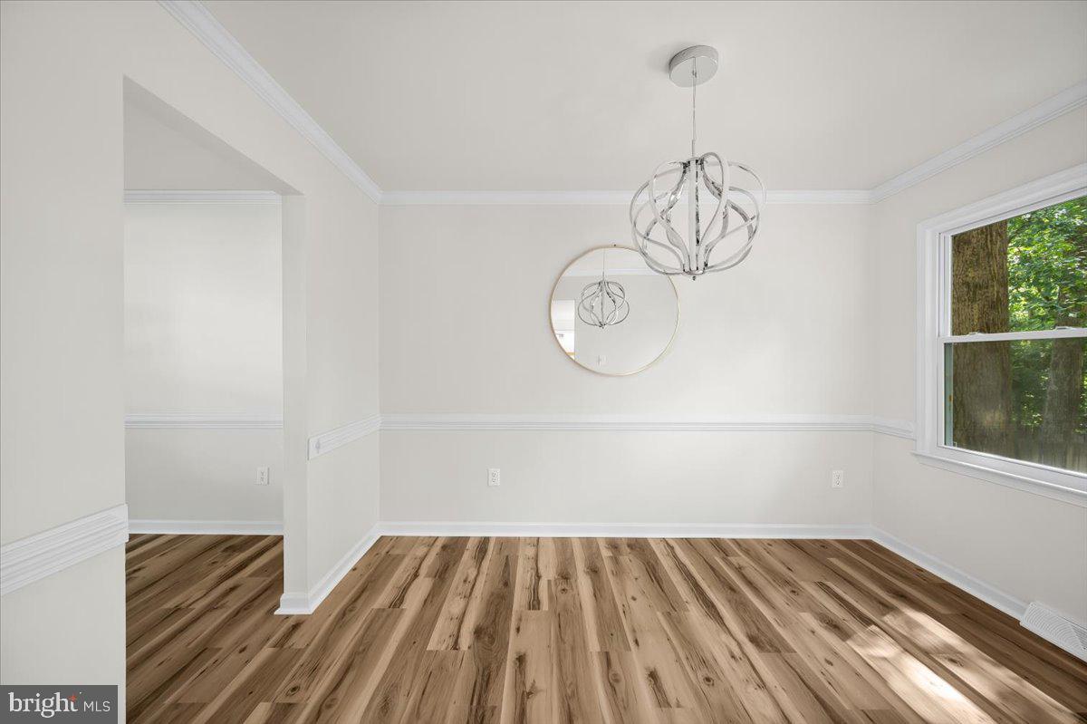 11816 Rutherford Drive Fredericksburg, VA 22407 - Photo 40 of 64 a view of a room with wooden floor and a window