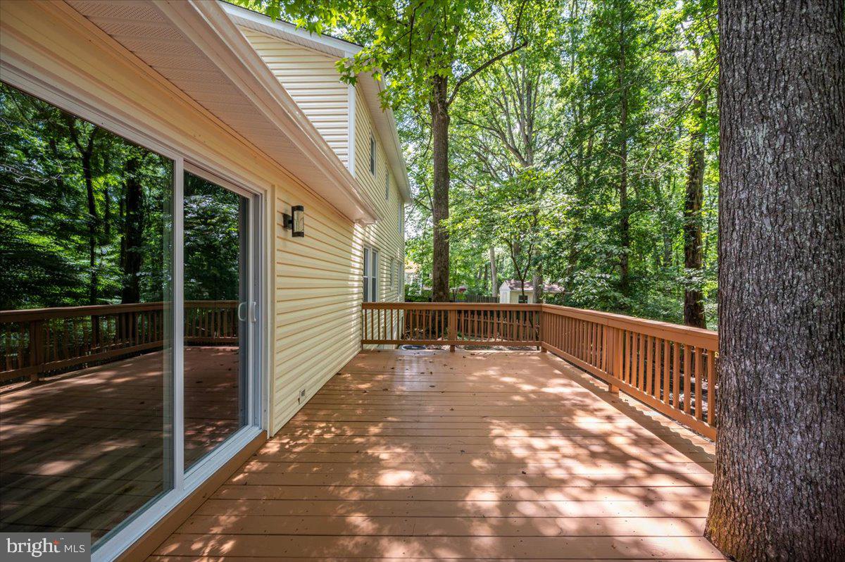 11816 Rutherford Drive Fredericksburg, VA 22407 - Photo 54 of 64 a view of balcony with floor to ceiling window and wooden fence