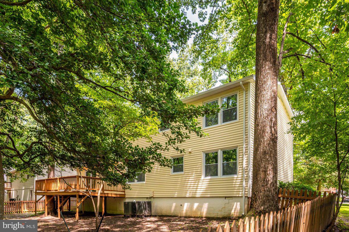 11816 Rutherford Drive Fredericksburg, VA 22407 - Photo 59 of 64 front view of a house with a tree