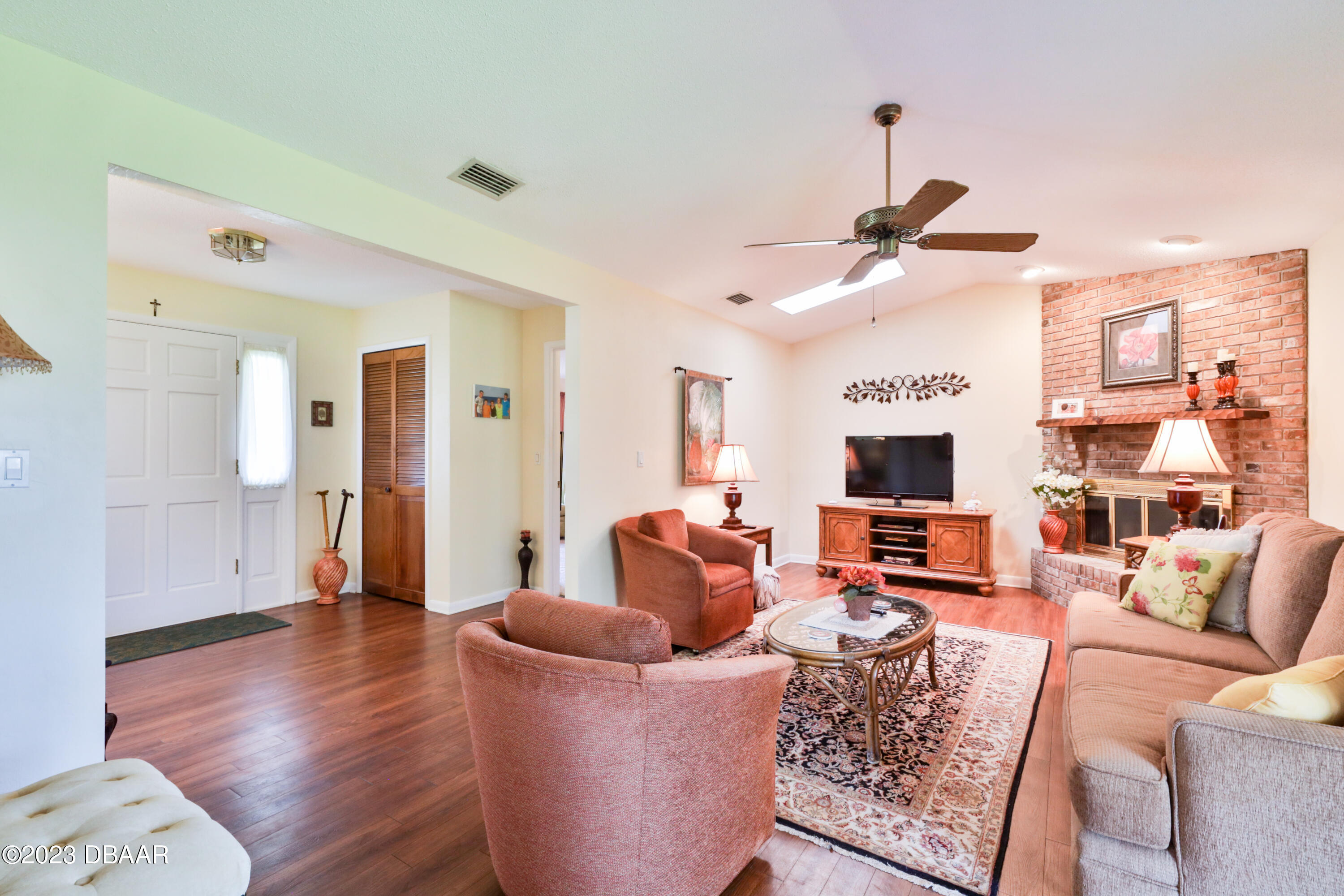 118 Sand Dunes Drive Ormond Beach, FL 32176 - Photo 18 of 46 a living room with furniture and a flat screen tv