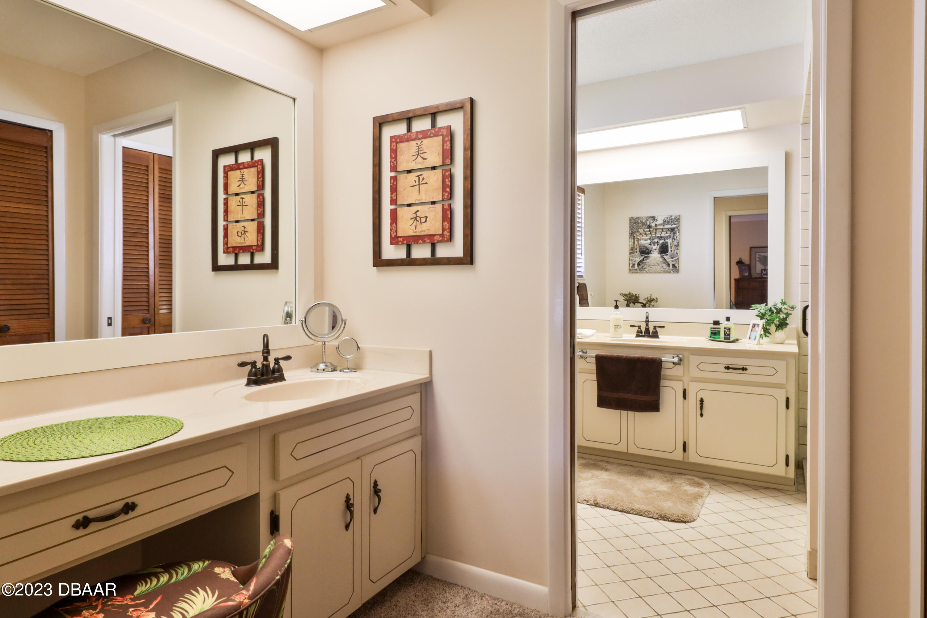 118 Sand Dunes Drive Ormond Beach, FL 32176 - Photo 30 of 46 a bathroom with a sink double vanity and a mirror