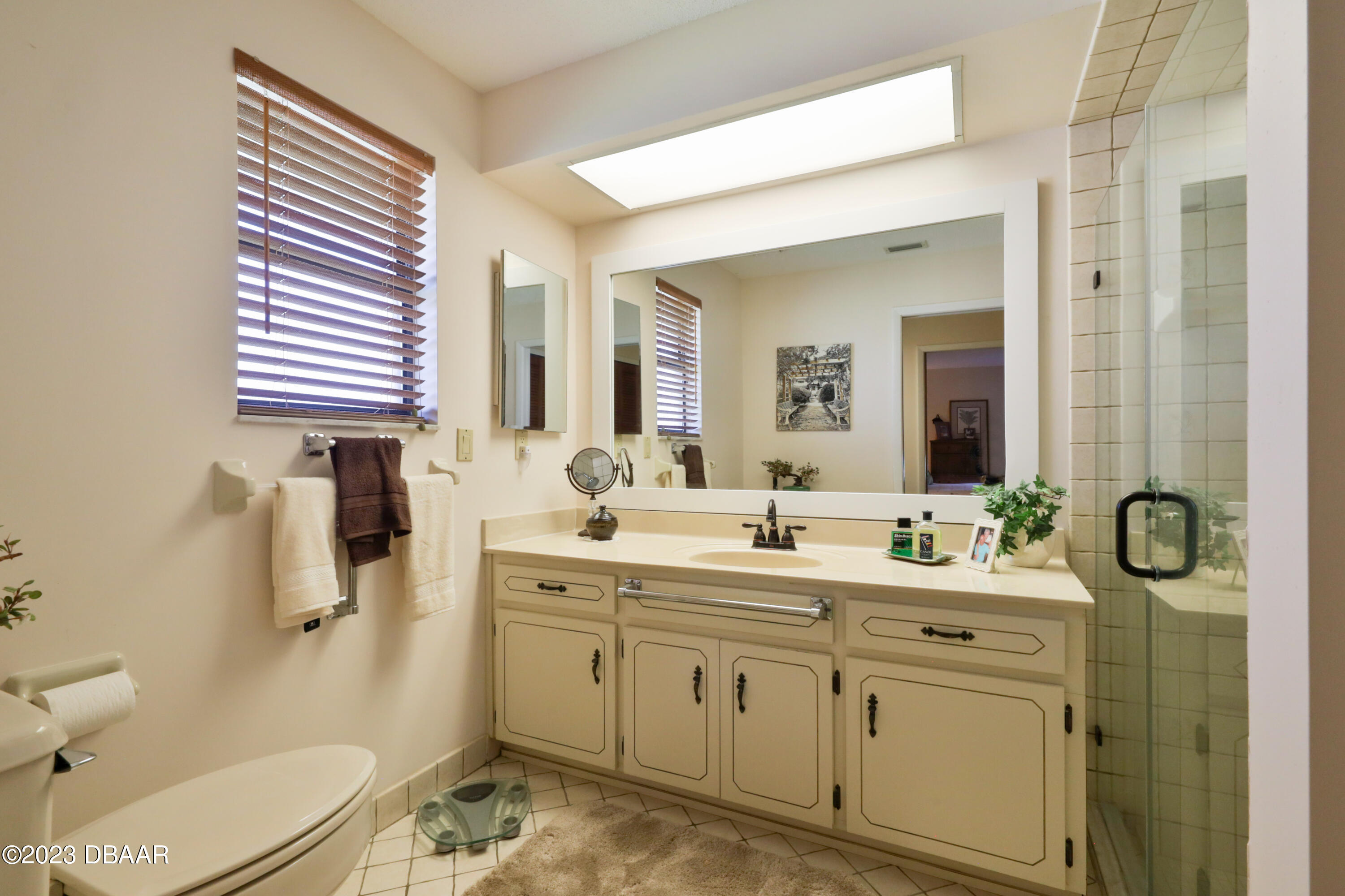 118 Sand Dunes Drive Ormond Beach, FL 32176 - Photo 31 of 46 a bathroom with a granite countertop sink mirror vanity and toilet