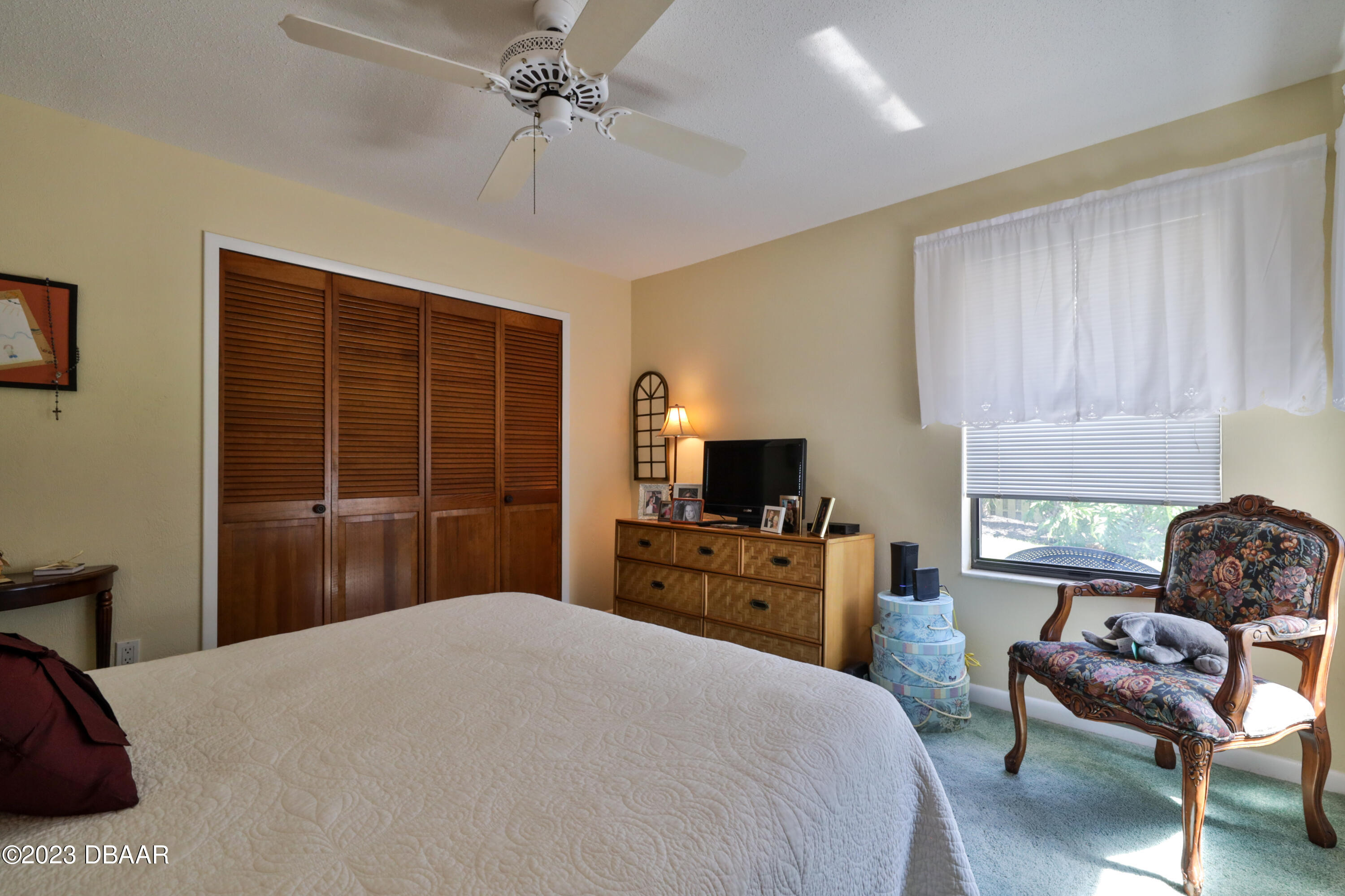 118 Sand Dunes Drive Ormond Beach, FL 32176 - Photo 34 of 46 a bedroom with a bed and furniture