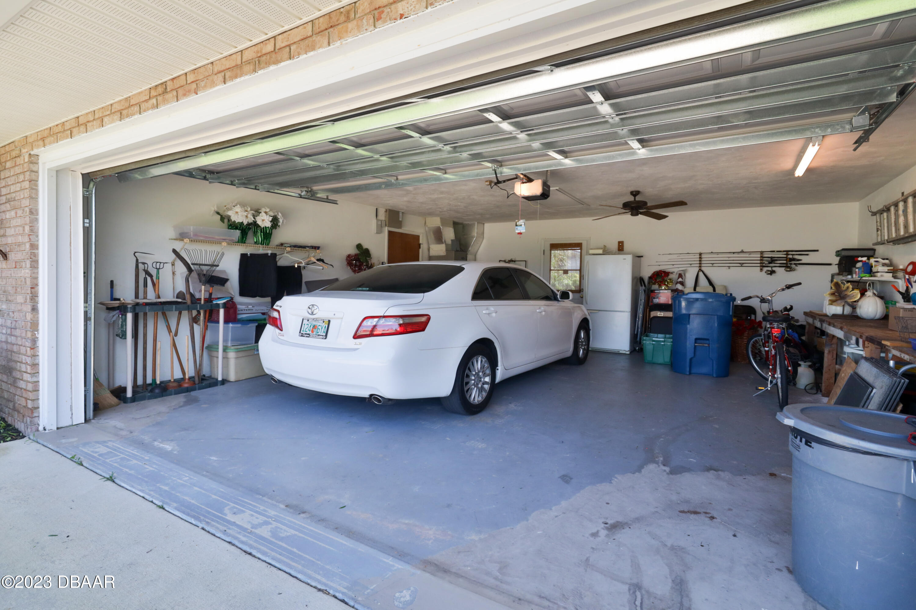 118 Sand Dunes Drive Ormond Beach, FL 32176 - Photo 37 of 46 a view of a porch with furniture and a garage