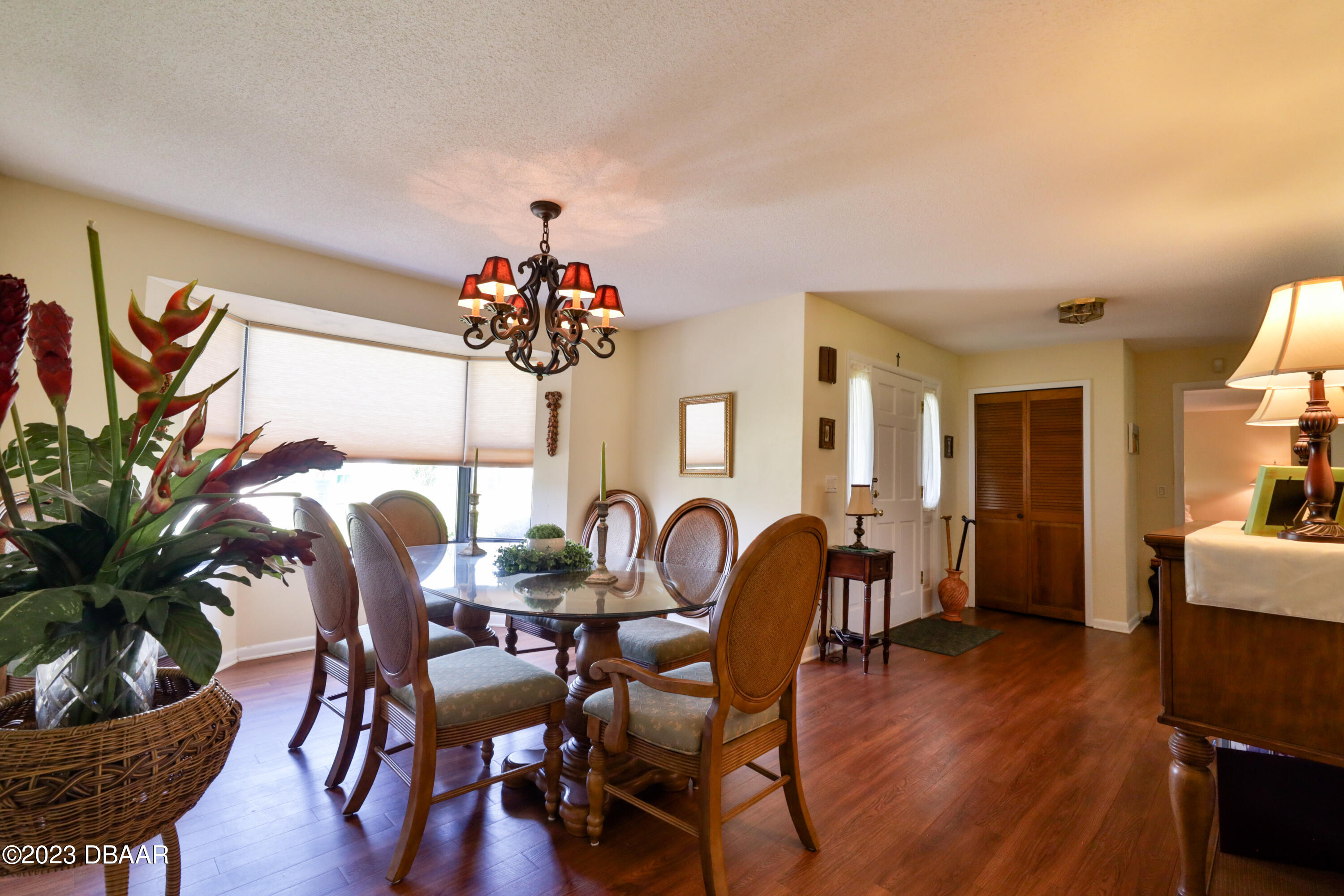 118 Sand Dunes Drive Ormond Beach, FL 32176 - Photo 9 of 46 a dining room with furniture and wooden floor