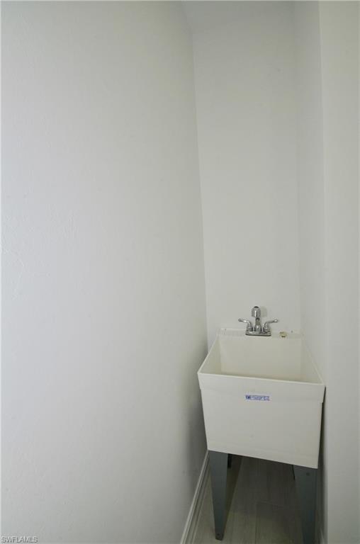 7509 Carnegie Way Naples, FL 34119 - Photo 12 of 33 a room with table and couch